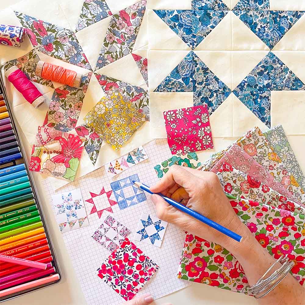 Alice Caroline designing Aurora Stars Rainbow Liberty Quilt BOM